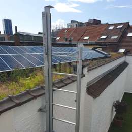 JOMY retractable ladder used to climb on roof for solar panels maintenance.