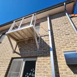 Balcony used to access a JOMY retractable fire escape ladder.