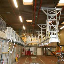 Drive-through working platform for bus maintenance on the roof.