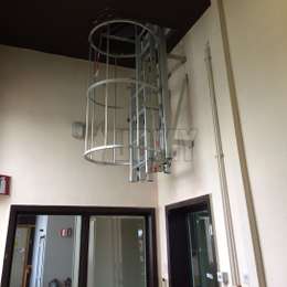 Drop-down cage ladder in a corridor.