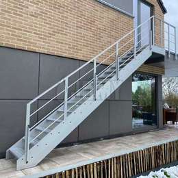 Exterior industrial stairs for roof terrace and garden access.