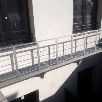 Fire escape access balcony in aluminum used for egress to a ladder.