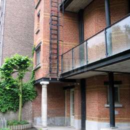 Fire escape drop-down ladder to evacuate from balconies to the street sidewalk.