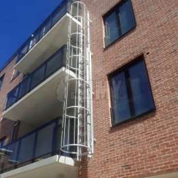 Fire escape ladder with cage and lateral access for balconies.