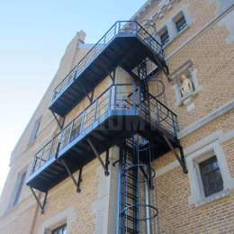 Custom fire escape facade walkways for cage ladders.