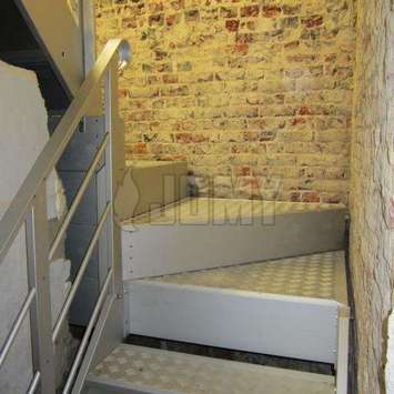 Industrial looking indoors stairs in old building