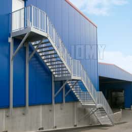 Inline stairs for fire evacuation, hanging from the wall.