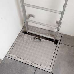 Manhole ladder for fire escape with a security hatch door.