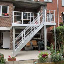 Custom-made metal balcony and access stairs