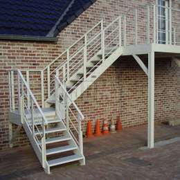 Metal stairs and landing outside a private house for access