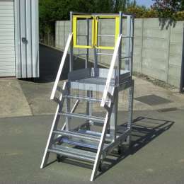 Mobile ladder work platform with yellow safety gates.