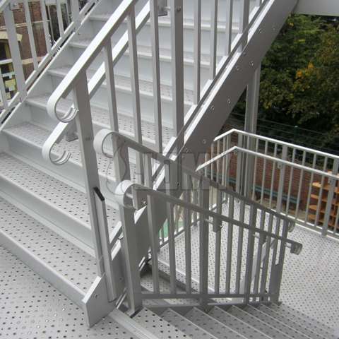 Handrails for both children and adults, mounted on the same evacuation stair.