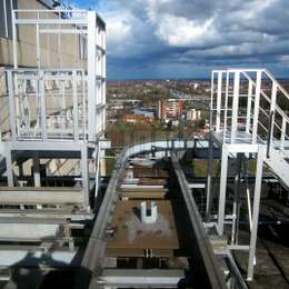 aluminum drawbridge walkway used to cross over a production line.